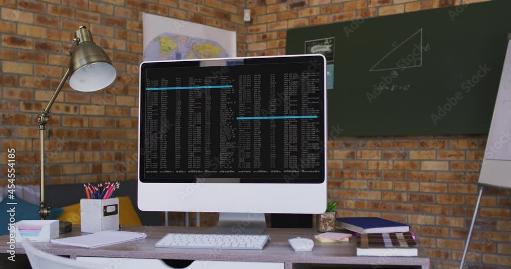 Poster computer screen with data processing standing on desk in office