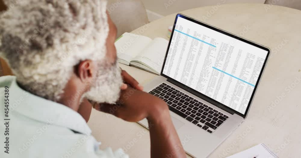 Poster African american man sitting at desk watching coding data processing on laptop screen