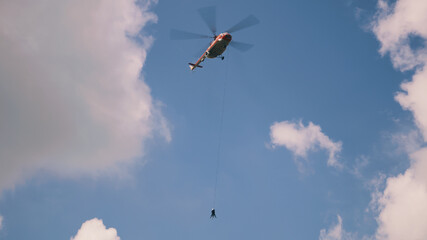 Helicopter with fire extinguisher in sky