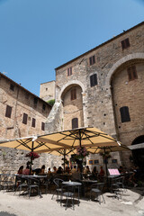 The historic center of San Gimignano, a typical medieval village in Tuscany. Narrow streets, numerous stone towers characterize the urban landscape