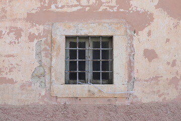 Fototapeta na wymiar Pink Aged House Facade Detail with Window in Rural Village, Central Italy