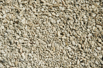 Natural colorful pebble stones background texture with copy space.