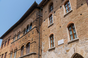 The historic center of San Gimignano, a typical medieval village in Tuscany. Narrow streets, numerous stone towers characterize the urban landscape