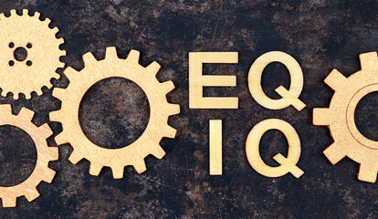 Emotional intelligence, iq eq and empathy concept, wooden text and gears - obrazy, fototapety, plakaty
