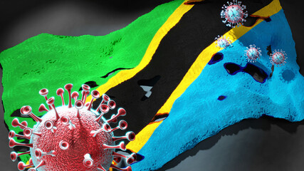 Covid in Tanzania United Republic of - coronavirus attacking a national flag of Tanzania United Republic of as a symbol of a fight and struggle with the virus pandemic in this country, 3d illustration