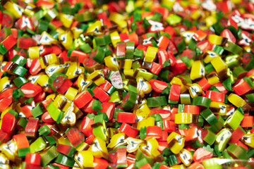 Fototapeta na wymiar Fruit-shaped multi-colored jelly sweets.