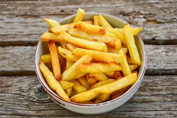 Home made   Fresh fried French fries on wooden rustic  background
