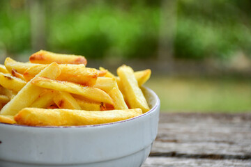 Home made   Fresh fried French fries on wooden rustic  background