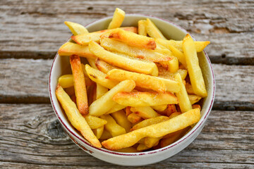 Home made   Fresh fried French fries on wooden rustic  background