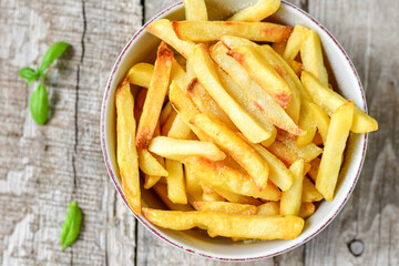 Home made   Fresh fried French fries on wooden rustic  background