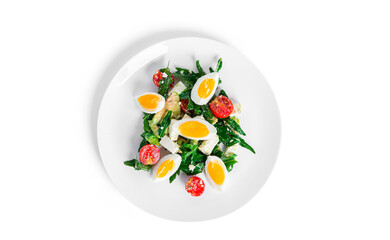 Salad of arugula, avocado, cherry tomatoes and eggs isolated on a white background. Green salat. Vegetarian salad.