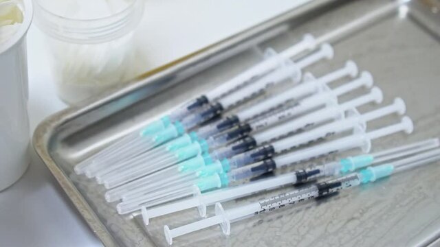 Covid 19 vaccines. Syringe and vials