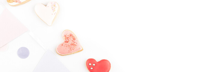 Obraz na płótnie Canvas Heart shaped cookies with colorful festive confetti