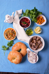 Food on the table. Meat, vegetables, homemade buns