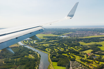 Plain wing over Holland. Flight from Helsinki to Amsterdam.