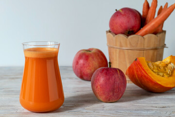 Apple carrot juice with pumpkin. Vitamin autumn drink.