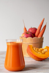 Apple carrot juice with pumpkin. Vitamin autumn drink.