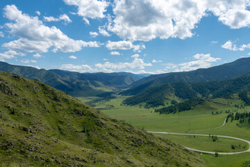 Fototapeta premium winding highway climbing a mountain pass on a summer day