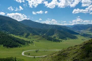 Fototapeta na wymiar winding highway climbing a mountain pass on a summer day