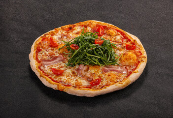 Pizza with bacon and rucola