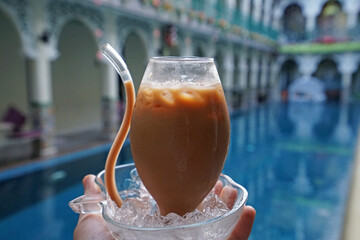 Close up Masala Nepali (Nepal) milk tea in unique shape glass