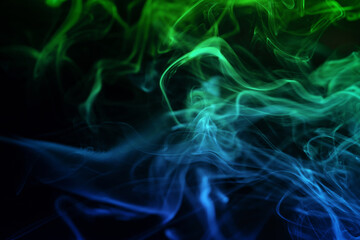 Abstract colored smoke moves on dark background. Wallpaper. Personal vaporizers fragrant steam. Concept of alternative non-nicotine smoking. E-cigarette. Texture. Design elements.