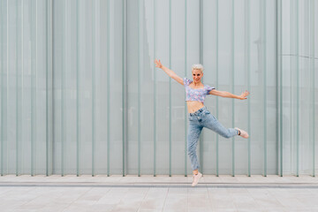 Young caucasian woman outdoor jumping celebrating success feeling free