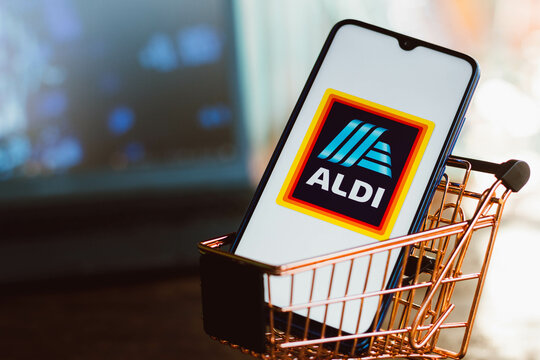 September 2, 2021, Brazil. In this photo illustration the Aldi logo displayed on a smartphone along with a shopping cart.