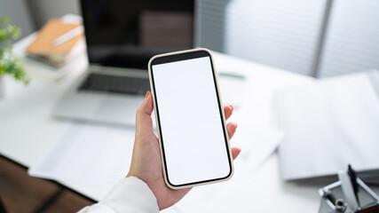 Cropped shot view of Women's hands holding cell telephone blank copy space screen. smart phone with technology concept