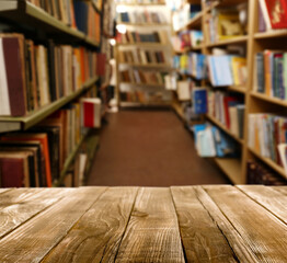 Empty wooden table in library. Space for design