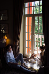 romantic and gentle morning of men and women at the window
