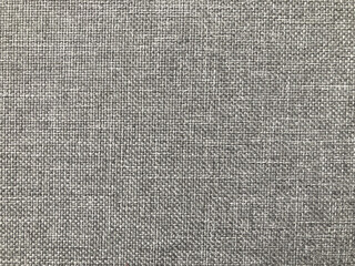 The background is decorative. Fabric background. Gray fabric. Weaving.