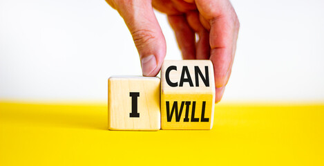 I can and will symbol. Businessman turns a cube and changes words i can to i will. Beautiful white...