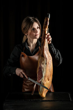 Slicing Hamon iberico whole leg, Jamon serrano. Traditional Spanish ham