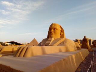 Fototapeta na wymiar The sand town sculpture in Hurghada at the sundown. Egypt.