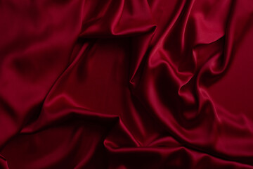 Red smooth cloth folds texture background