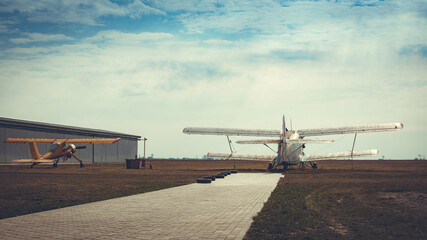 old vintage small airplanes at the airfield outdoors