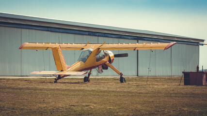 old vintage small plane at the airfield outdoors