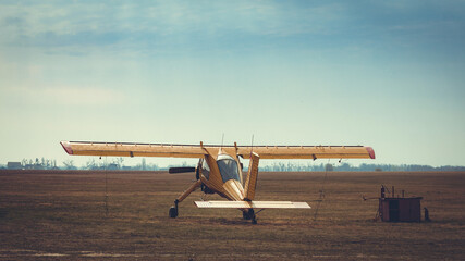 old vintage small plane at the airfield outdoors