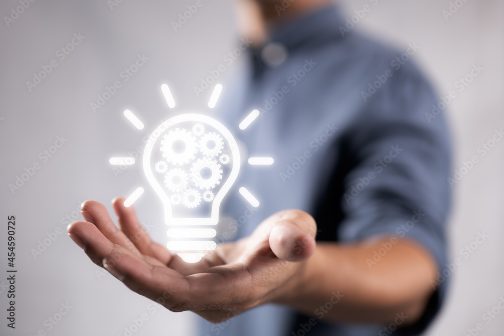 Poster business idea bulb gear web engineering button icon on hand