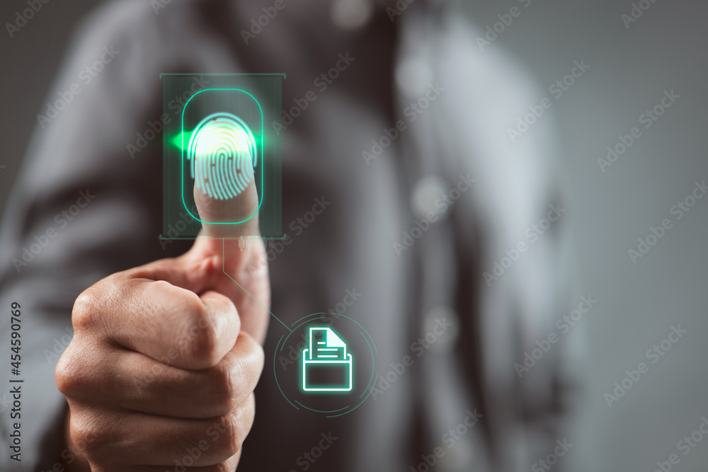 Leinwandbilder Businessman scan fingerprint biometric identity and approval to access file folder. Business concept of the future of security and password control through fingerprints in an immersive technology