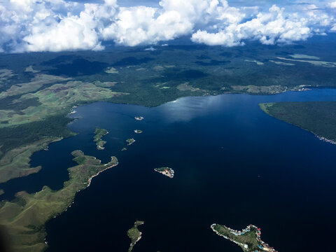 The aerial view of the islands of Jayapura, Papua, Indonesia. Shot from flying plane 