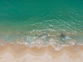 PHUKET,THAILAND. Aerial view beach and sea. White beach beach sand and blue sea water. White yacht on sea.