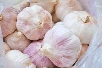 Whole Garlic in a plastic bag.