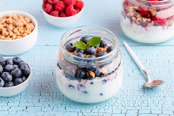 Healthy breakfast. Granola / muesli yoghurt and fruit.