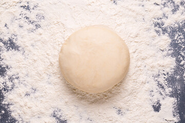 Baking or cooking background, flour on the dark background.