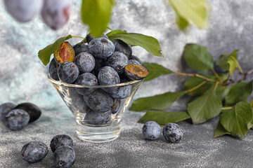 Plums on a light background. Harvesting the autumn harvest. Making jam and sauce. Still life.