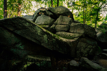 Majestic glacial stone hill at Purgatory Chasm Park in Massachusetts. Abstract geological shapes and patterns of curving flow and mystical power. © Naya Na