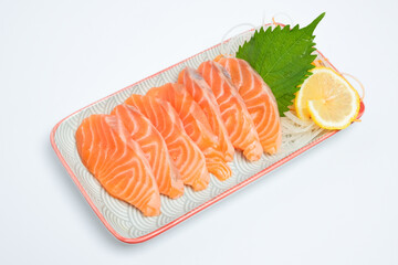 Salmon sashimi on a plate, white background