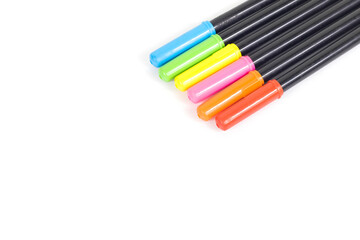 Magic multicolored pens isolated on white background